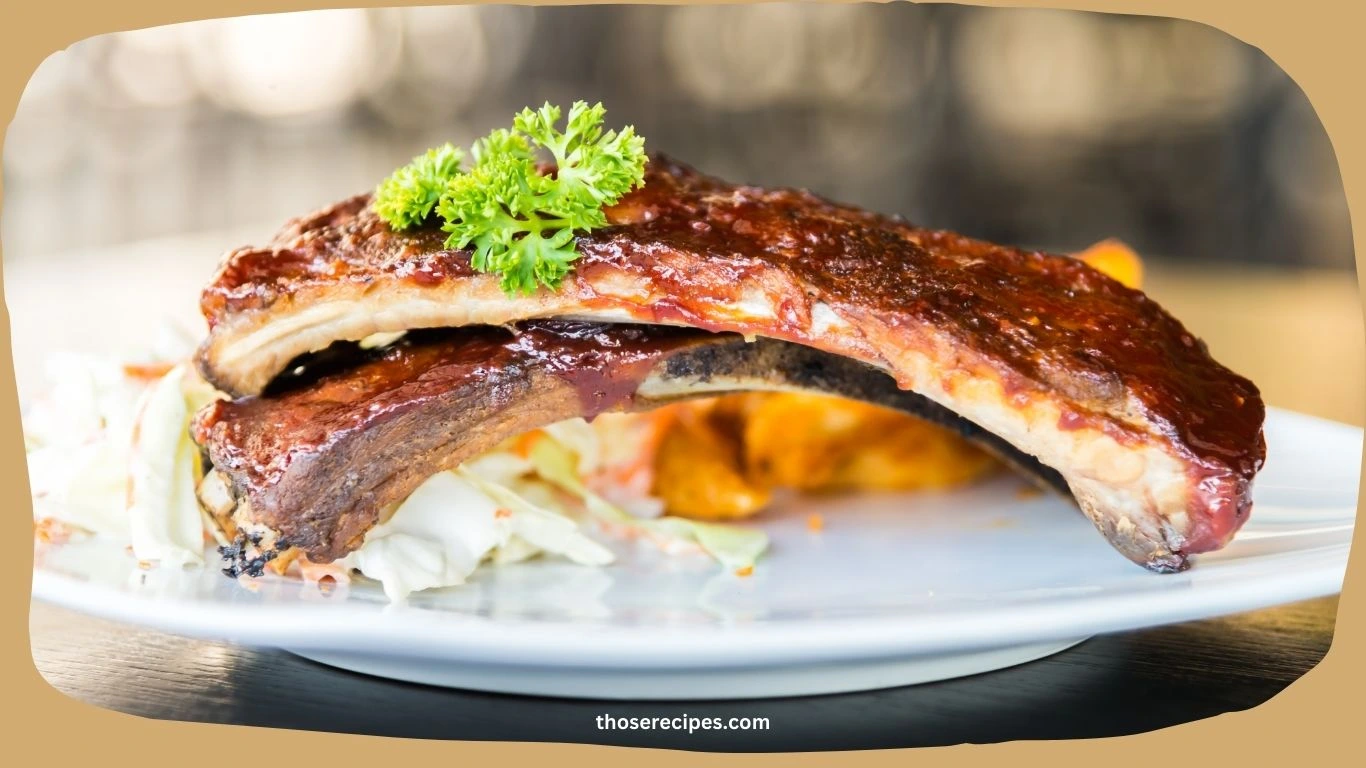 Tender beef back ribs glazed with barbecue sauce on a serving plate